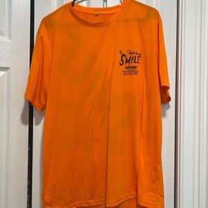Orange T-shirt with positive vibe quote on front and back